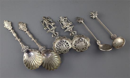 A pair of late Victorian silver serving spoons, a pair of Dutch silver silver spoons and one other pair of spoons with coin bowls.